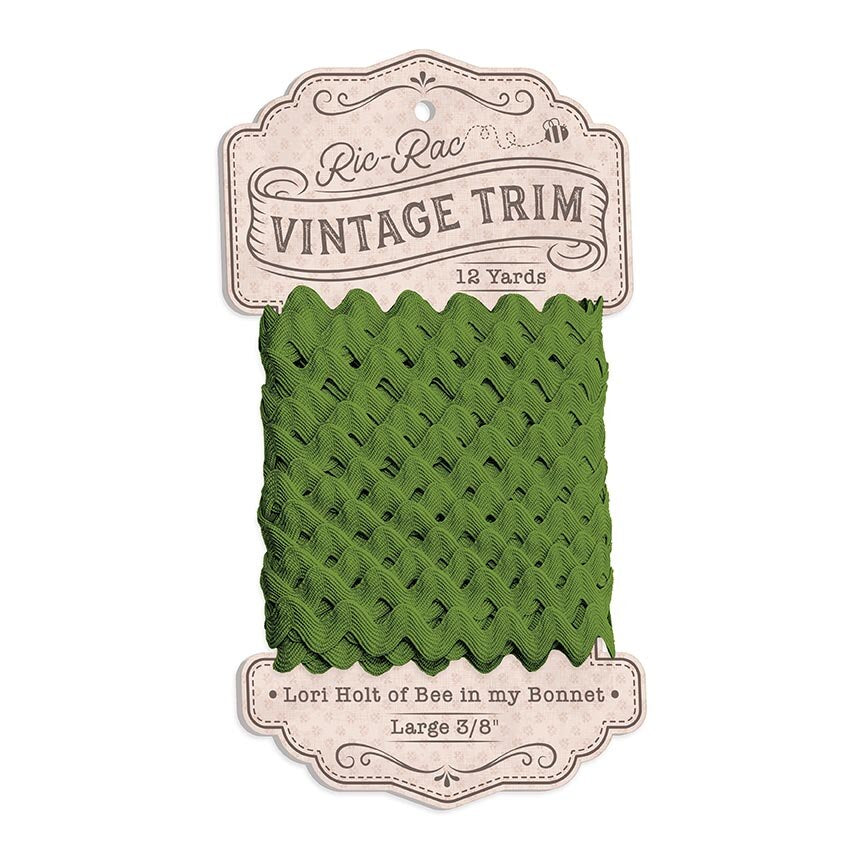 Green lace trim on a 'Ric Rac Vintage Trim' packaging with branding details.