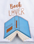 Embroidered design of a book with 'Book Lover' text on a white background