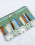 Pouch with book design on a light background