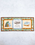 Decorative mat with book-themed illustrations and text on a white background