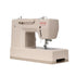 A beige Singer Heavy Duty sewing machine with a red logo printed on the side, shown from a three-quarter angle against a solid white background.