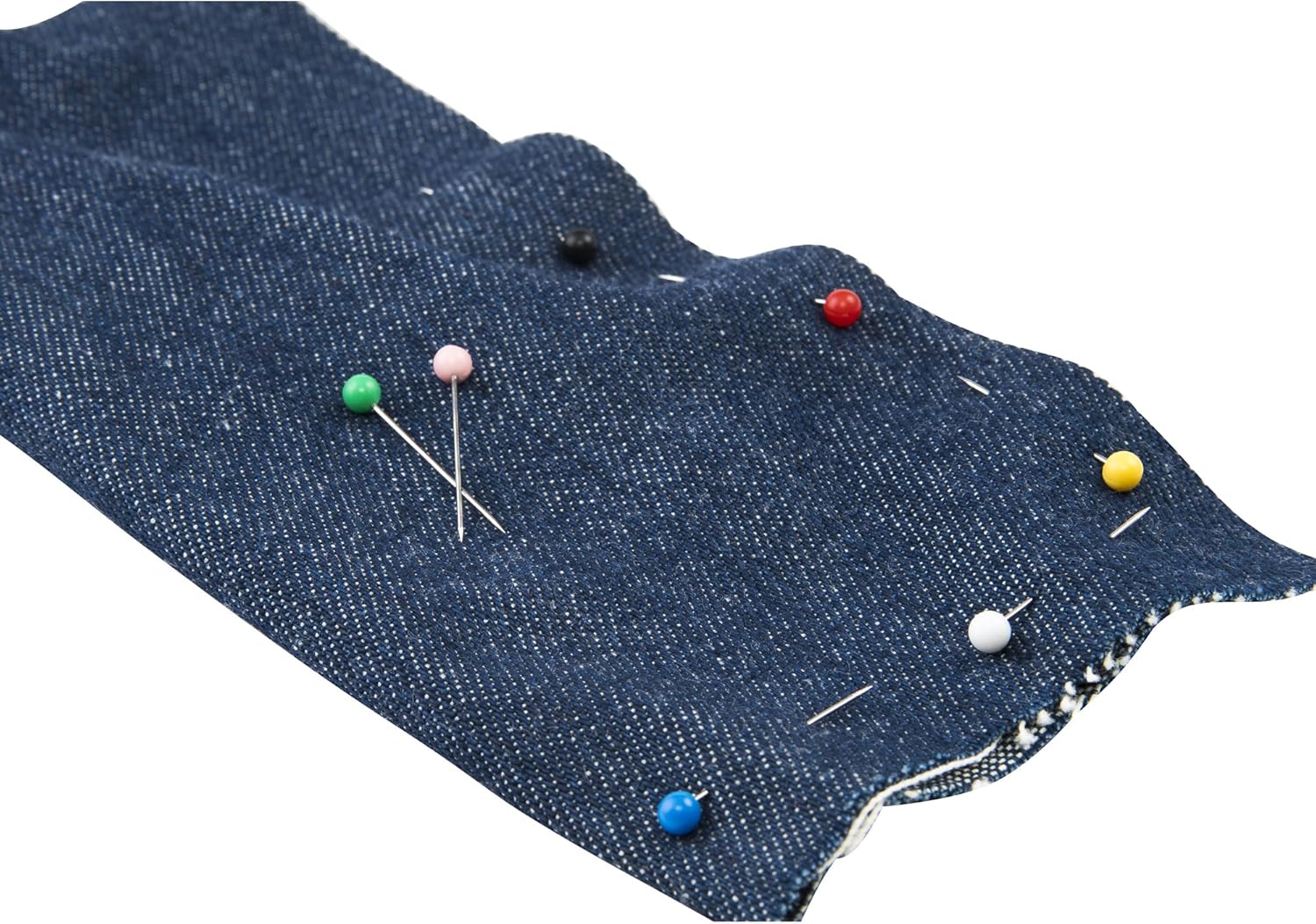 Blue denim fabric with colorful pins on a white background