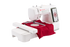 A white Singer embroidery machine with a digital touchscreen display, shown with a red fabric hoop insert and a red fabric piece under the needle, isolated on a white background.