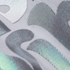 Close-up of textured vinyl with geometric patterns in gray, black, and green.