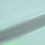 Close-up of white vinyl roll with a gradient effect transitioning from green to gray.