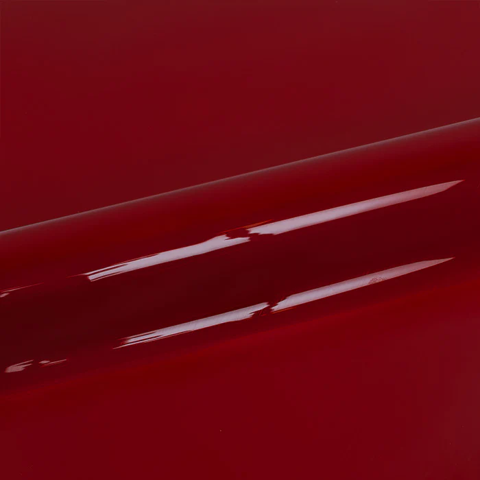 Glossy red vinyl roll with reflections