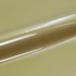 Roll of gold vinyl wrap on a gold background