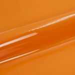 Close-up of a glossy orange vinyl roll