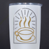 White tumbler with gold coffee cup design on a black background