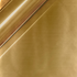 Close-up of a gold-colored metal surface with a reflective sheen