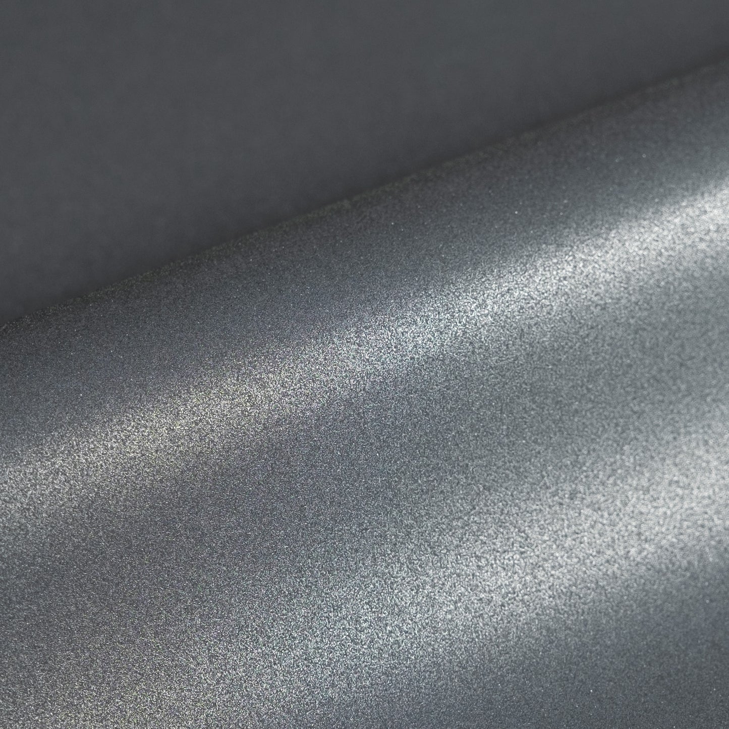 Close-up of metallic silver vinyl texture
