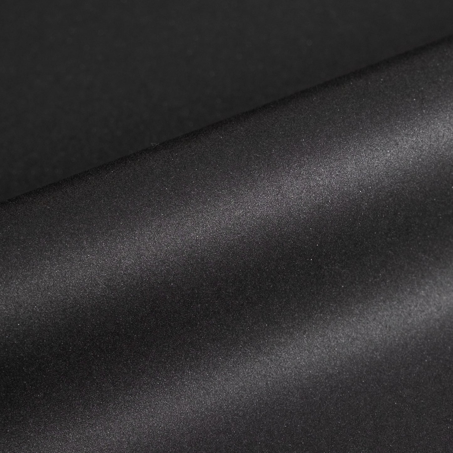 Close-up of black textured vinyl roll