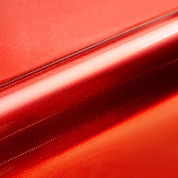 Close-up of red vinyl wrap with a glossy finish