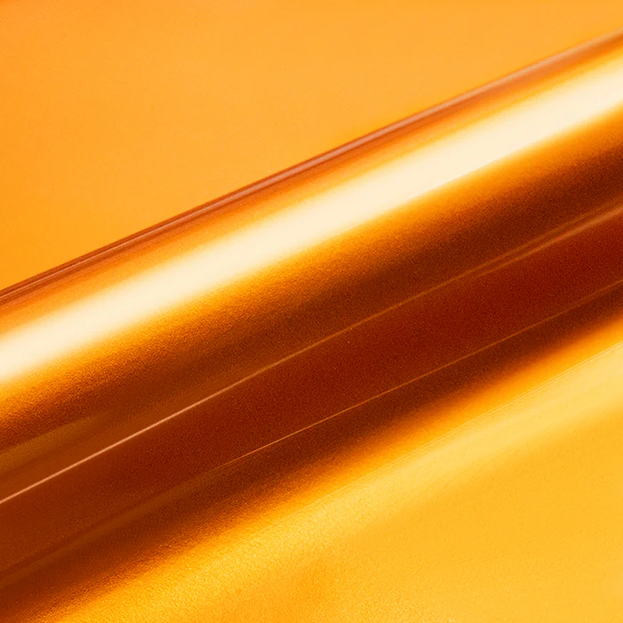 Close-up of a roll of orange vinyl wrap