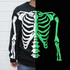 Black sweatshirt with a skeleton design split between white and green on a black background.