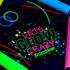 Glow in the dark vinyl 'Let's Glow Crazy' text on a black background