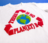 White t-shirt with a graphic of the Earth surrounded by red text on a blue background