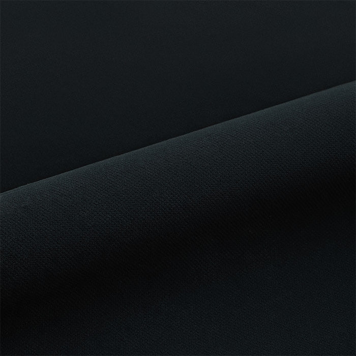 Black puffy vinyl roll on a dark background