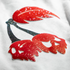 Close-up of red and black glittery designs on a white background