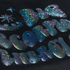 Glittery blue and purple letters spelling 'Big Scorpio Energy' on a black background