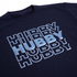 Black t-shirt with 'HUBBY' text in metallic blue on a white background