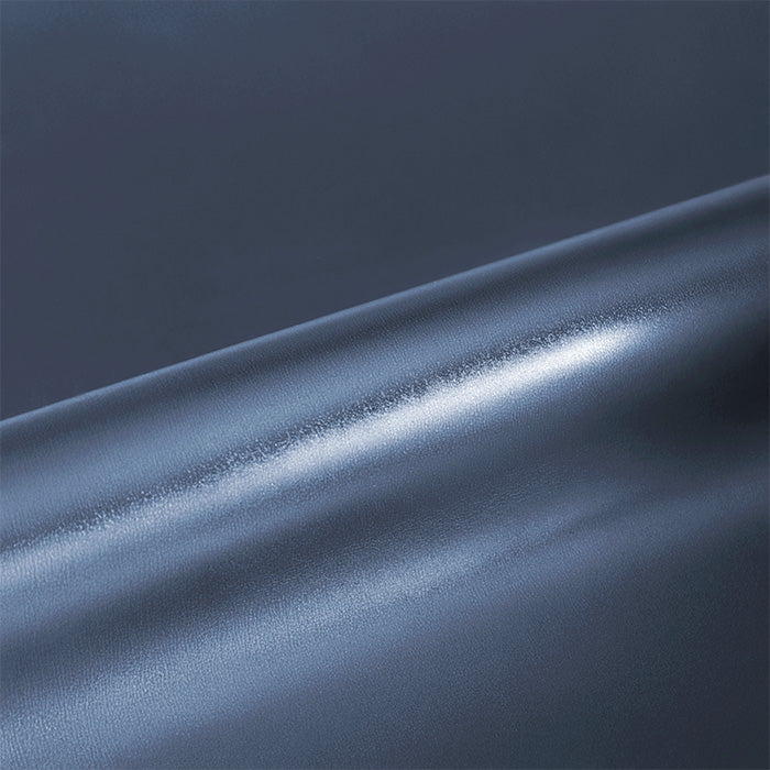 Close-up of a metallic blue vinyl roll with a glossy finish