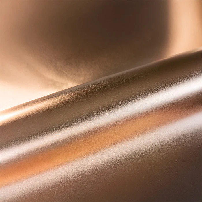 Close-up of a metallic vinyl roll with a reflective surface