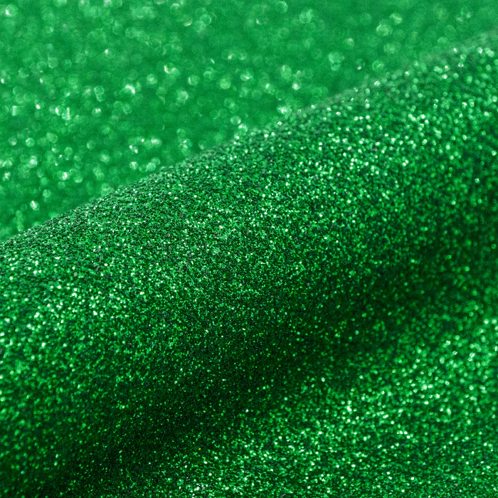 Close-up of green glittery fabric texture