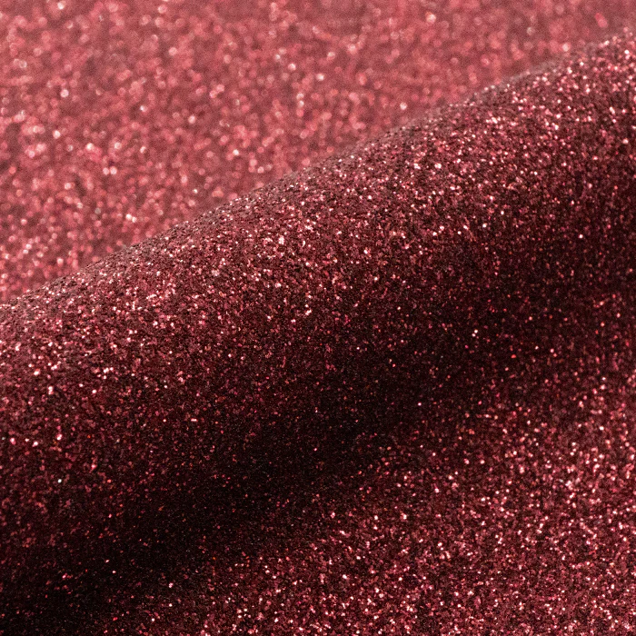 Close-up of red glittery vinyl texture