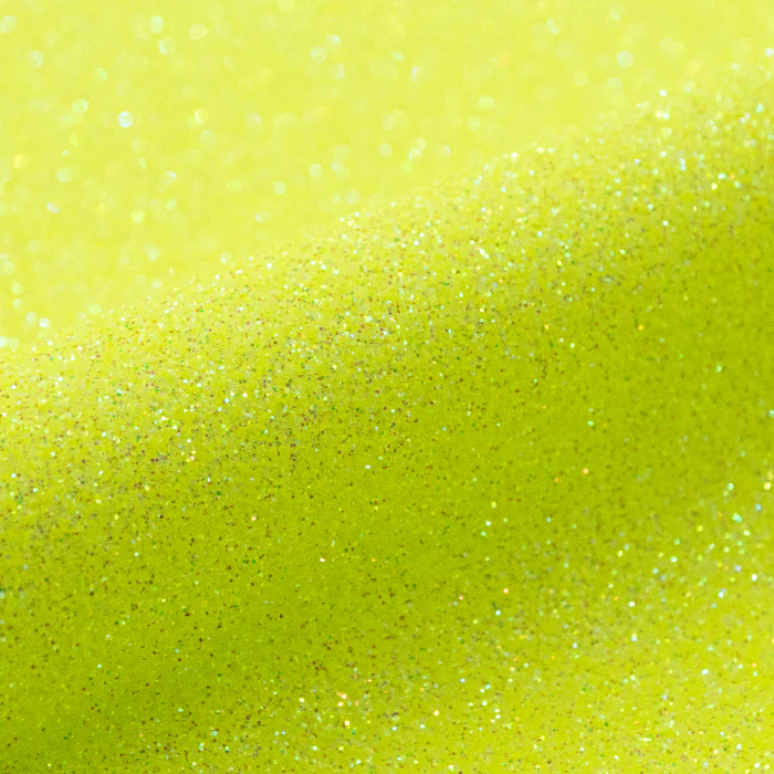 Close-up of a bright yellow vinyl roll with glitter