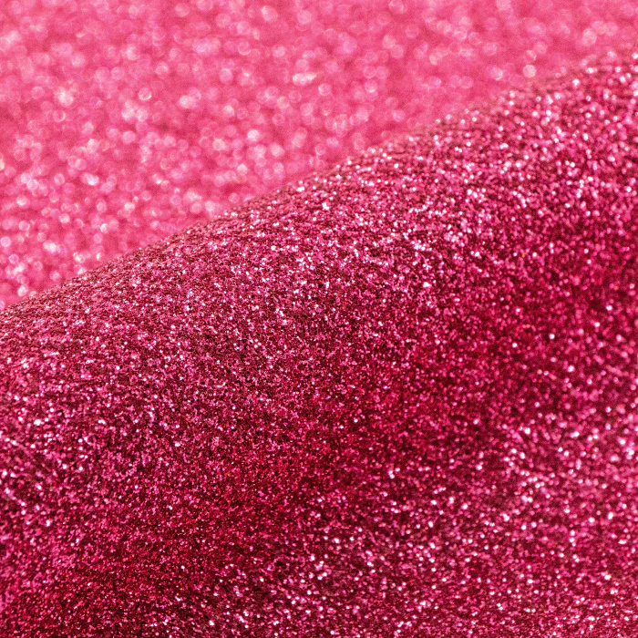 Close-up of pink glitter vinyl roll