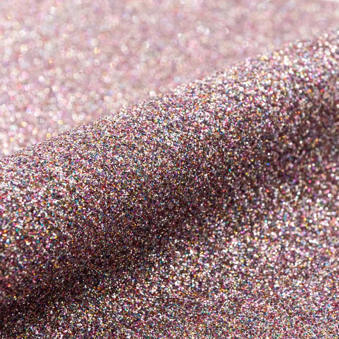 Close-up of glittery vinyl with a pinkish-purple hue