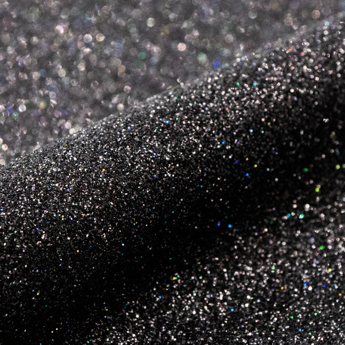 Close-up of black glitter with a gradient effect