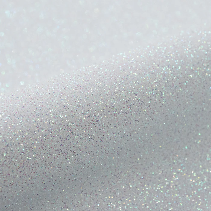 Silver glitter texture on a light gray background
