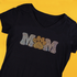 Black t-shirt with 'Mom' and paw print design on a yellow background