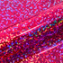 Close-up of a colorful glittery vinyl roll with red and pink hues.