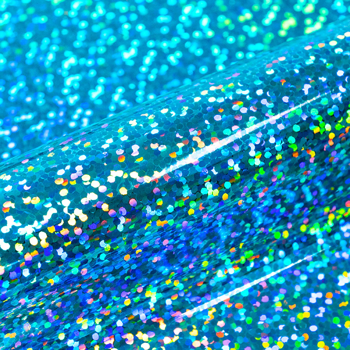 Holographic glittery vinyl with blue and green hues