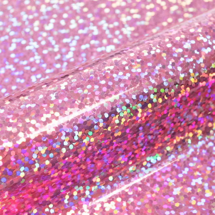 Close-up of pink glittery vinyl with a shiny texture