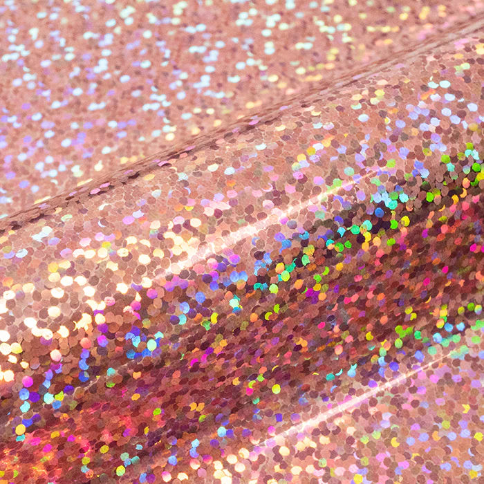 Close-up of a glittery vinyl roll with multicolored sequins.