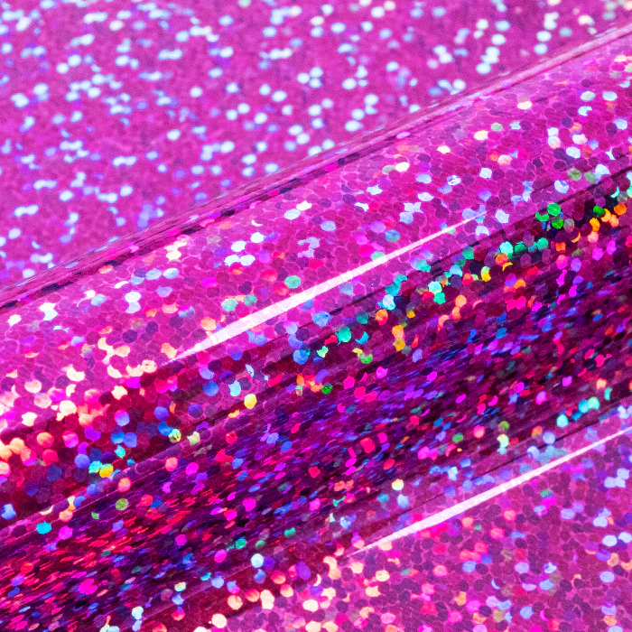 Close-up of pink glittery vinyl with a shiny surface