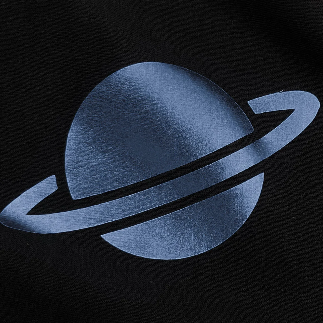 Blue planet with rings on a black background