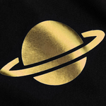 Gold Saturn-like symbol on a black background