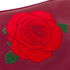 Red rose design on a maroon background