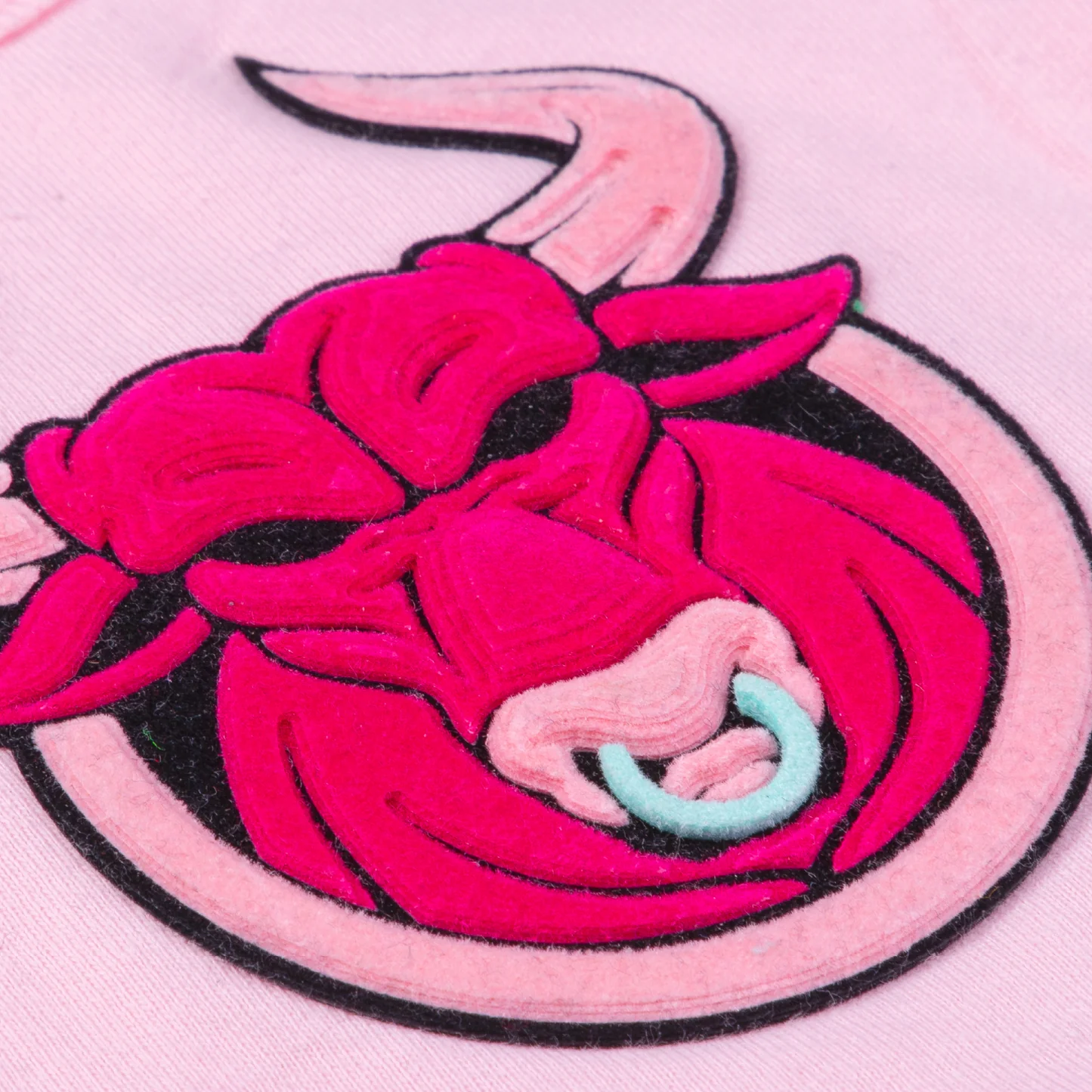 Pink and black bull design on a pink background