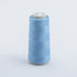 Light blue spool of thread on a light gray background