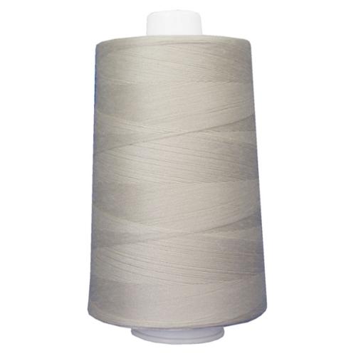 Spool of gray thread on a white background
