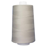 Spool of gray thread on a white background