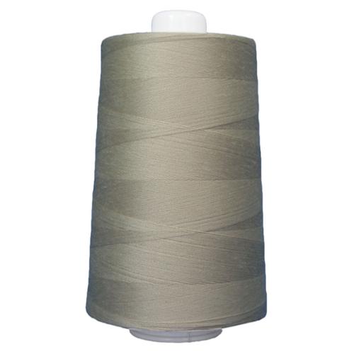Spool of gray thread on a white background