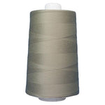 Spool of gray thread on a white background