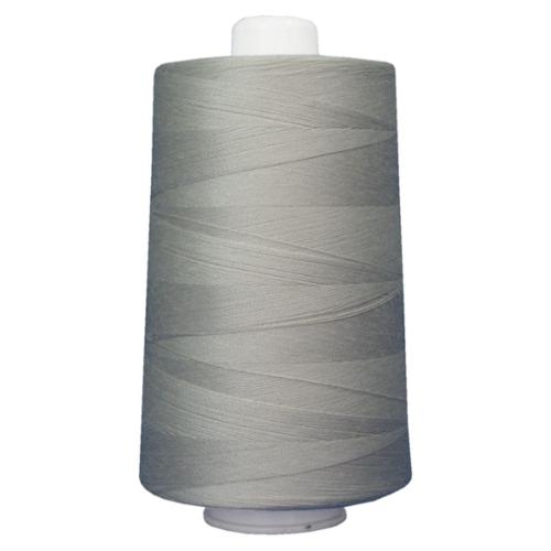 Large spool of gray thread on a white background